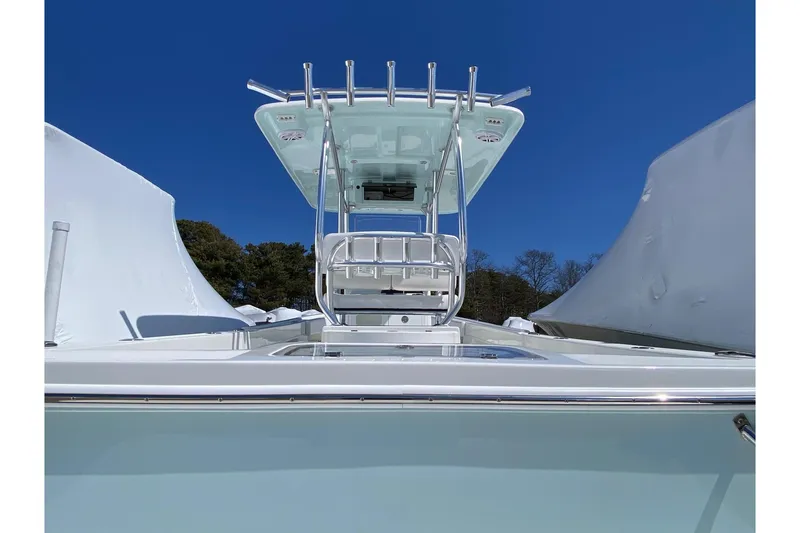 Slide: The Image of 2026 Pair Customs 24 Center Console DV Offshore boat under clear blue sky. - 3