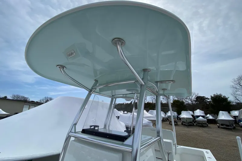 Slide: The Image of 2026 Pair Customs 24 Center Console DV Offshore boat with sleek T-top design. - 6