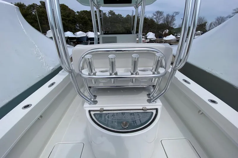 Slide: The Image of 2026 Pair Customs 24 Center Console DV Offshore boat interior with rod holders and storage. - 9
