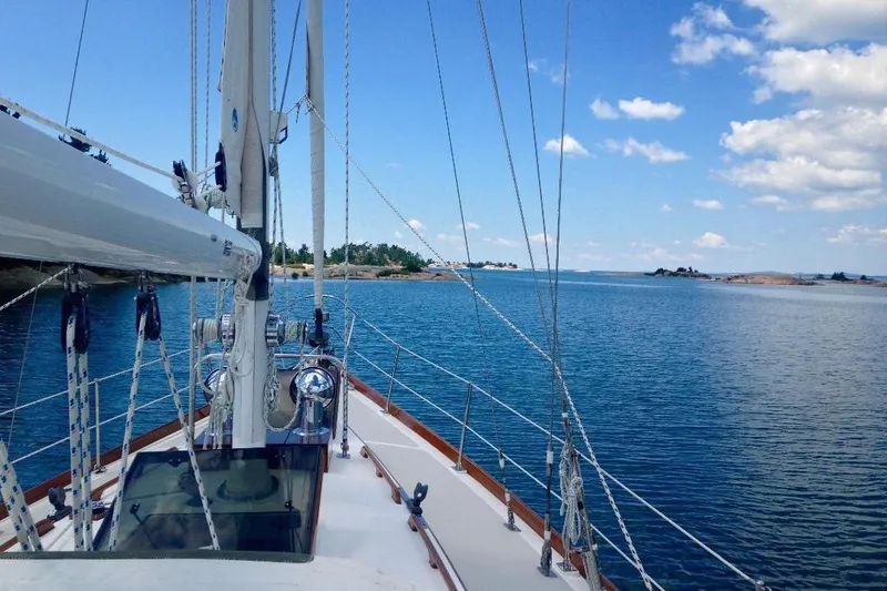 Slide: The Image of Sailing on a 1985 Pearson Yachts 36-2, surrounded by serene blue waters and clear skies. - 5