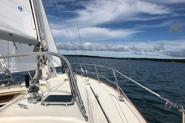 Slide: The Image of Sailing on a 1985 Pearson Yachts 36-2 under a clear blue sky. - 6