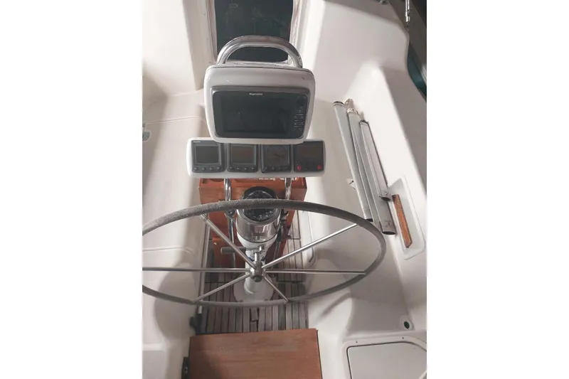 Slide: The Image of Cockpit of 1985 Pearson Yachts 36-2 with steering wheel and navigation instruments. - 7