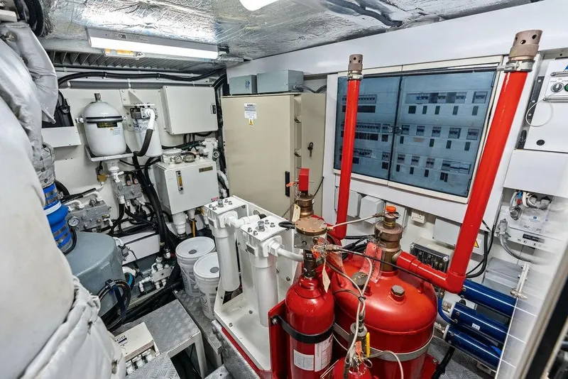 Slide: The Image of Engine room of a 2012 Sunseeker 88 Yacht, featuring complex machinery and equipment. - 107