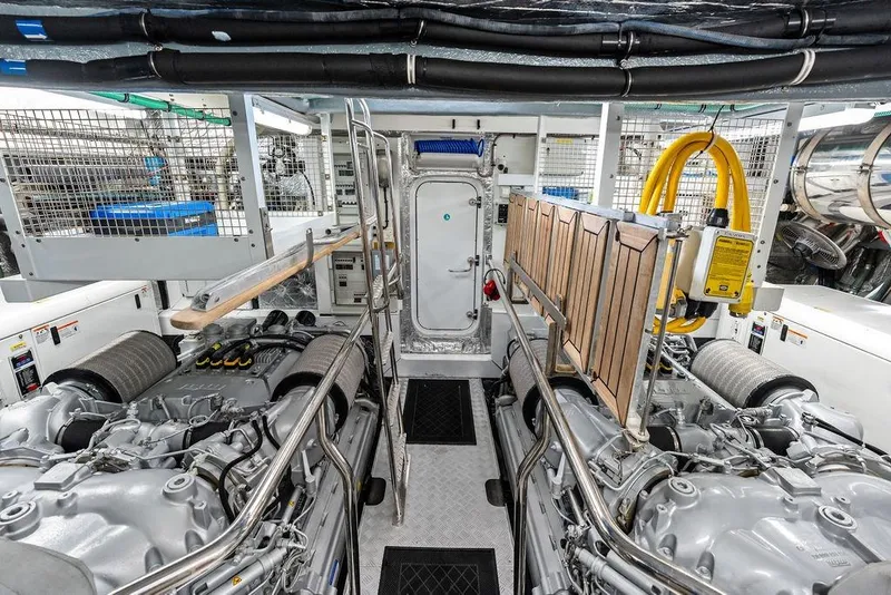 Slide: The Image of Engine room of 2012 Sunseeker 88 Yacht, featuring dual engines and organized layout. - 108