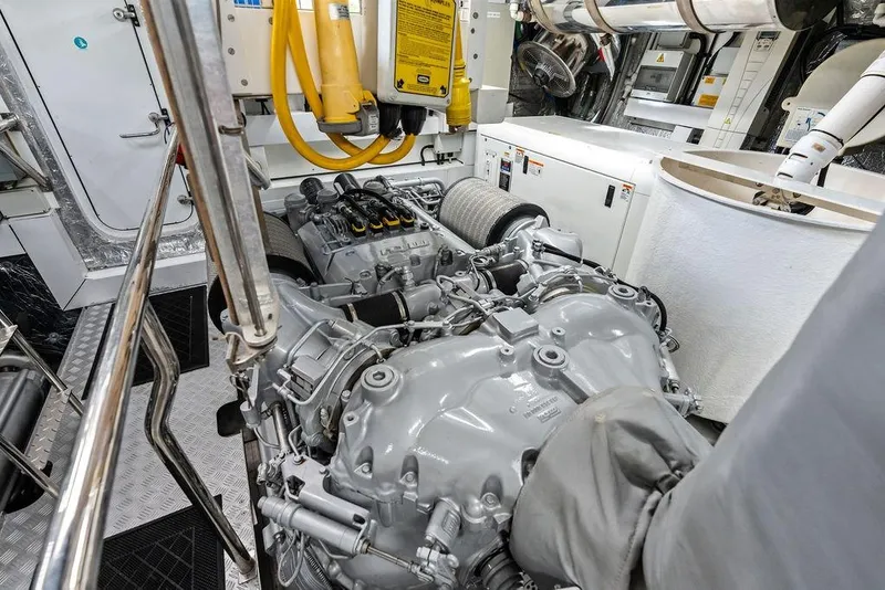 Slide: The Image of Engine room of a 2012 Sunseeker 88 Yacht, showcasing mechanical components and equipment. - 110
