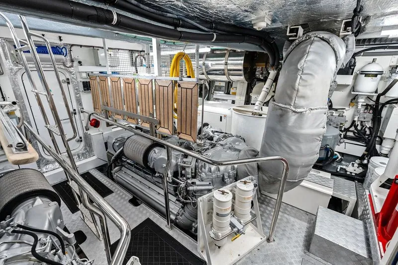 Slide: The Image of Engine room of a 2012 Sunseeker 88 Yacht, showcasing machinery and equipment. - 116