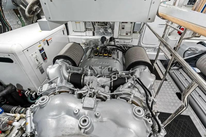 Slide: The Image of Engine room of a 2012 Sunseeker 88 Yacht, showcasing detailed machinery and components. - 117