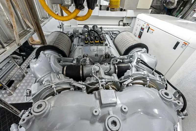 Slide: The Image of Engine room of a 2012 Sunseeker 88 Yacht, showcasing detailed machinery and components. - 118