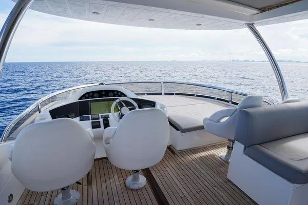 Slide: The Image of Luxurious 2012 Sunseeker 88 Yacht helm with ocean view and elegant seating. - 15