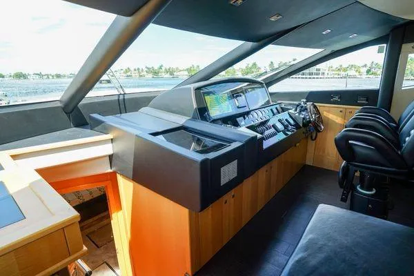 Slide: The Image of Luxurious helm of 2012 Sunseeker 88 Yacht with advanced navigation controls. - 23