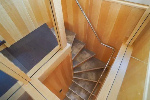 Slide: The Image of Staircase with wooden paneling inside a 2012 Sunseeker 88 Yacht. - 27