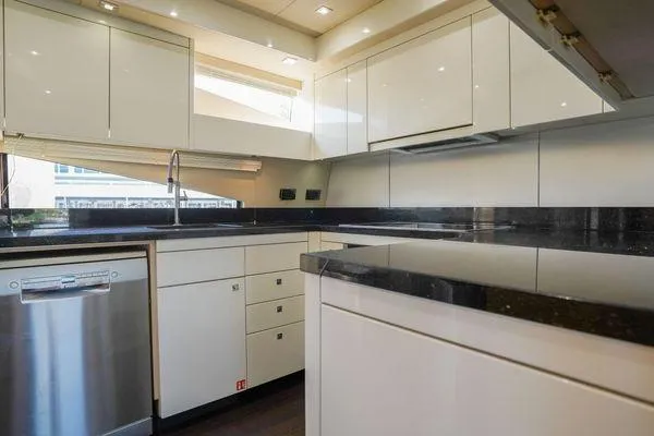 Slide: The Image of Modern kitchen interior on 2012 Sunseeker 88 Yacht with sleek cabinetry and stainless steel appliances. - 28