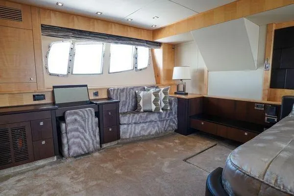 Slide: The Image of Luxurious interior of a 2012 Sunseeker 88 Yacht with elegant furnishings and natural light. - 34