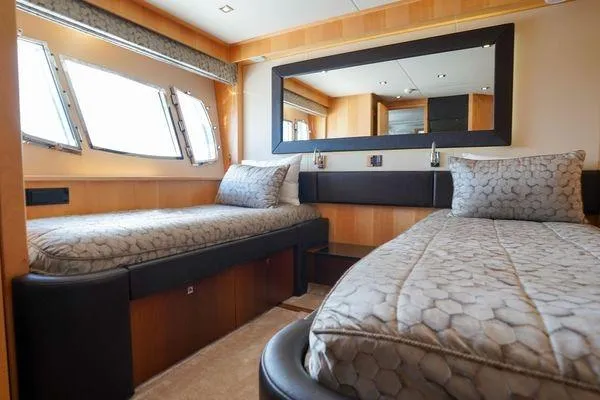Slide: The Image of Luxurious twin bedroom in 2012 Sunseeker 88 Yacht with elegant decor and large windows. - 36
