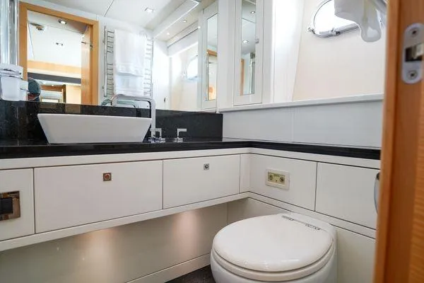 Slide: The Image of Luxurious bathroom in a 2012 Sunseeker 88 Yacht, featuring modern fixtures and elegant design. - 37