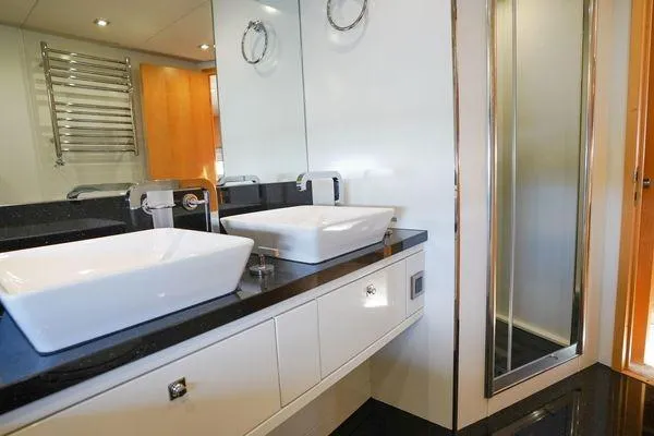 Slide: The Image of Luxurious bathroom on 2012 Sunseeker 88 Yacht with modern fixtures and dual sinks. - 43
