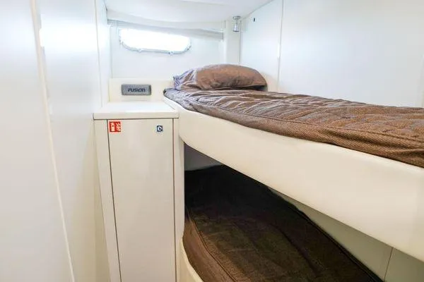 Slide: The Image of Interior of 2012 Sunseeker 88 Yacht featuring cozy bunk beds and a small window. - 46