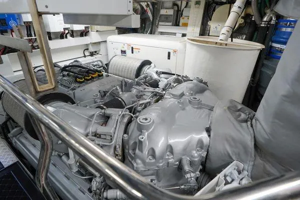 Slide: The Image of Engine room of a 2012 Sunseeker 88 Yacht, showcasing mechanical components. - 48