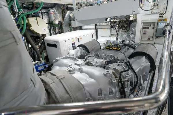 Slide: The Image of Engine room of a 2012 Sunseeker 88 Yacht, showcasing mechanical components and systems. - 49