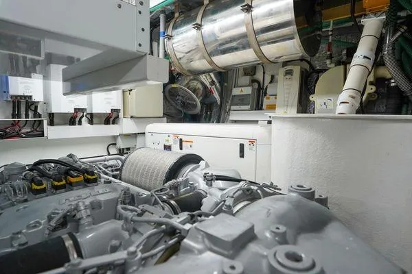 Slide: The Image of Engine room of a 2012 Sunseeker 88 Yacht, showcasing mechanical components and systems. - 50