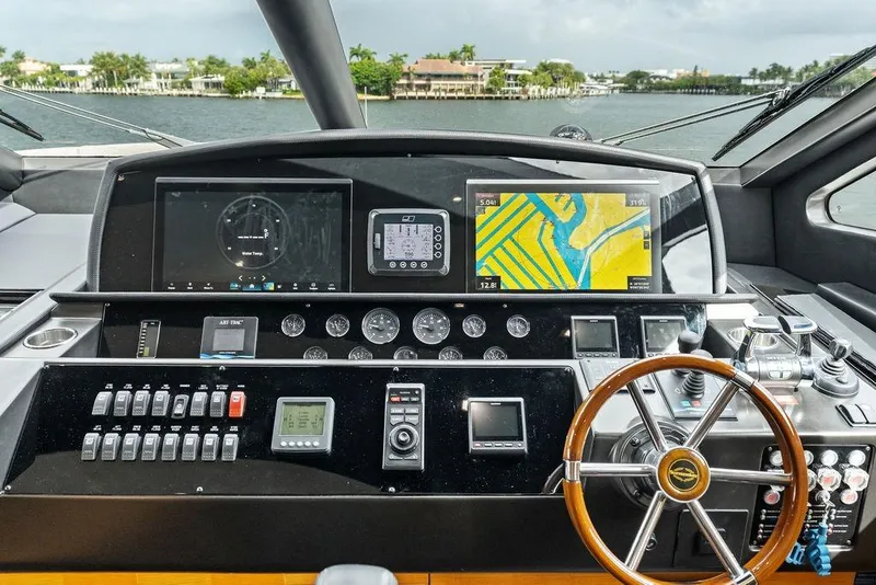 Slide: The Image of Cockpit of 2012 Sunseeker 88 Yacht with navigation screens and controls. - 51