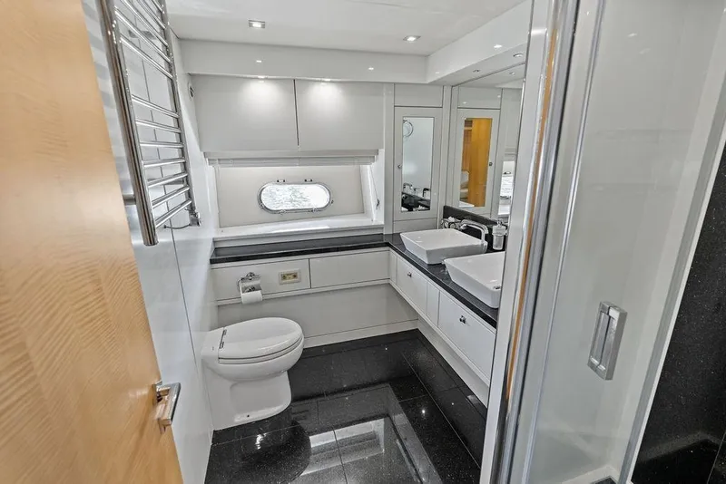 Slide: The Image of Luxurious bathroom in 2012 Sunseeker 88 Yacht, featuring dual sinks and modern fixtures. - 56