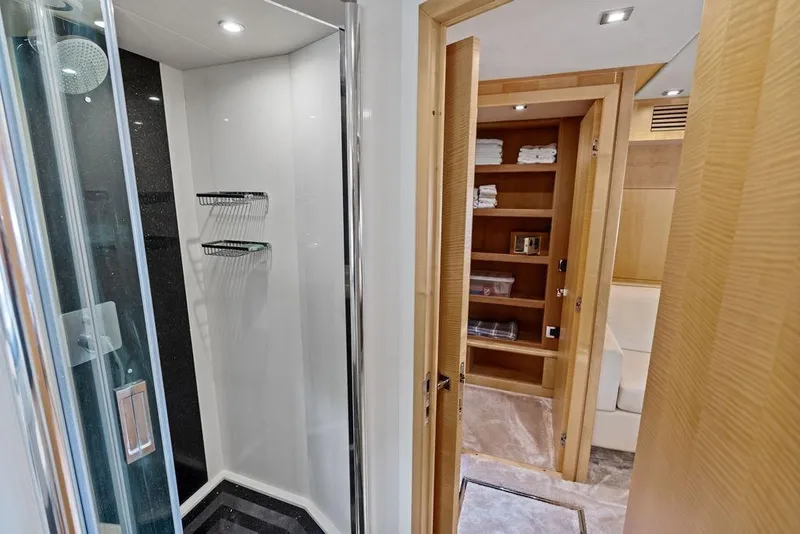 Slide: The Image of Luxurious bathroom and storage area on a 2012 Sunseeker 88 Yacht. - 58