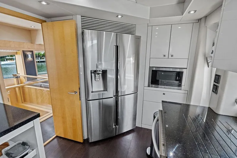 Slide: The Image of Modern kitchen interior on a 2012 Sunseeker 88 Yacht with stainless steel appliances. - 61