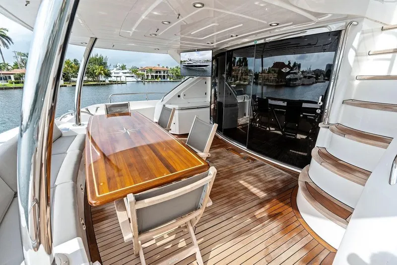 Slide: The Image of Luxurious Sunseeker 88 Yacht 2012 with elegant outdoor dining area and scenic waterfront view. - 66