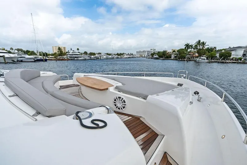 Slide: The Image of Luxurious 2012 Sunseeker 88 Yacht deck with elegant seating and scenic waterfront view. - 68