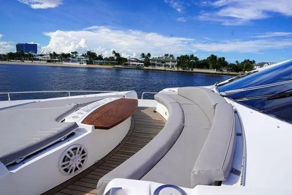 Slide: The Image of Luxurious 2012 Sunseeker 88 Yacht deck with elegant seating, overlooking serene waterfront views. - 7
