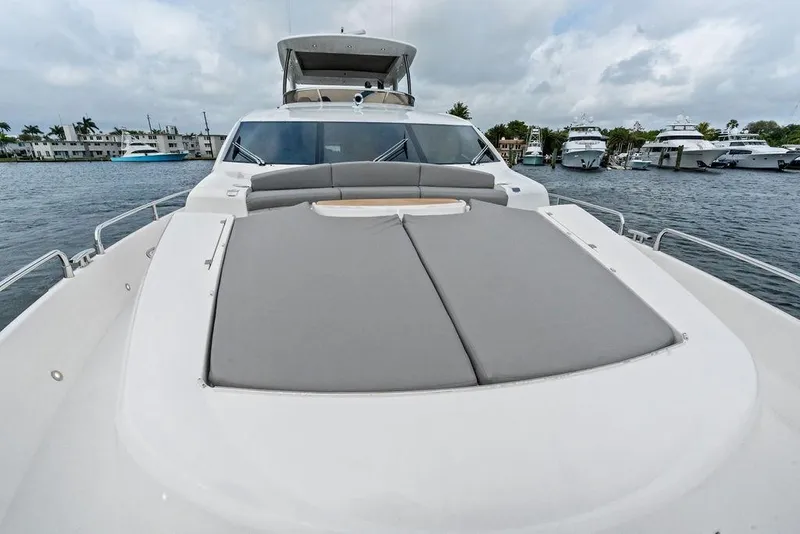 Slide: The Image of Luxurious 2012 Sunseeker 88 Yacht with spacious deck, docked in marina. - 70