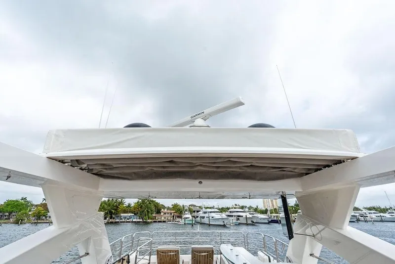 Slide: The Image of Sunseeker 88 Yacht 2012, upper deck view with radar, docked in marina. - 79
