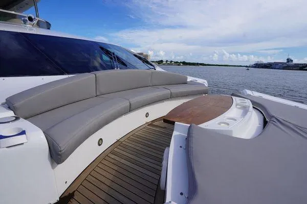 Slide: The Image of Luxurious Sunseeker 88 Yacht 2012 with elegant deck seating and scenic water view. - 8