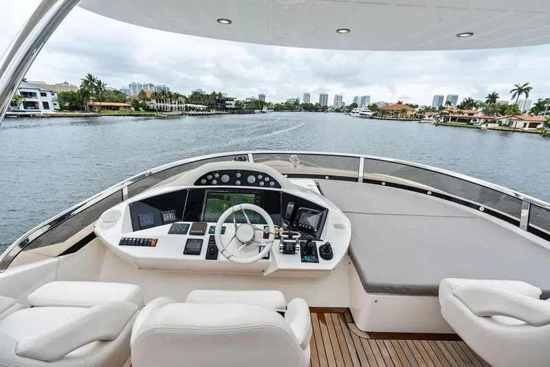 Slide: The Image of Luxurious 2012 Sunseeker 88 Yacht helm with waterfront view and modern controls. - 82