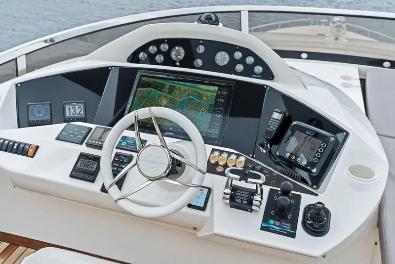 Slide: The Image of Helm of 2012 Sunseeker 88 Yacht featuring advanced navigation and control systems. - 83