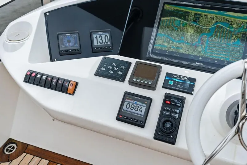 Slide: The Image of Control panel of a 2012 Sunseeker 88 Yacht with navigation and monitoring systems. - 85