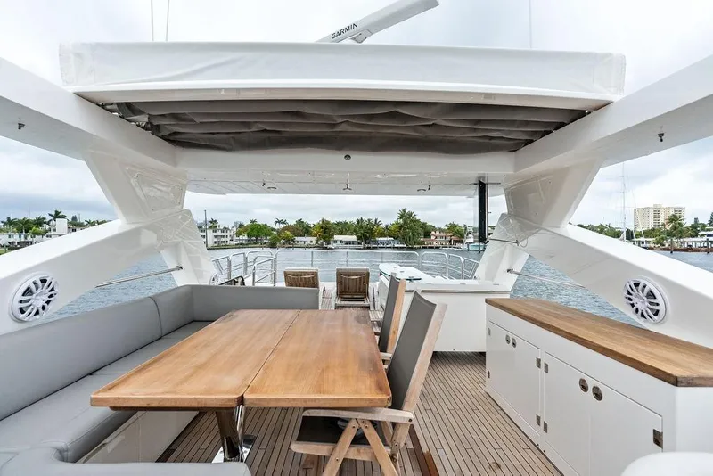 Slide: The Image of Luxurious Sunseeker 88 Yacht 2012 with elegant outdoor dining area and scenic waterfront view. - 86