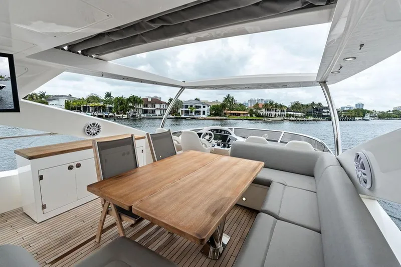 Slide: The Image of Luxurious Sunseeker 88 Yacht 2012 with elegant outdoor seating and scenic waterfront view. - 88