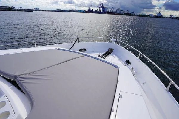 Slide: The Image of Sunseeker 88 Yacht 2012 on calm waters with spacious deck and scenic harbor view. - 9