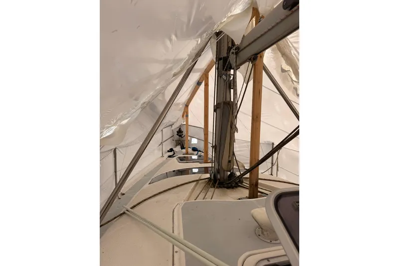Slide: The Image of Interior view of a 1997 Hunter 340 sailboat under protective cover. - 7