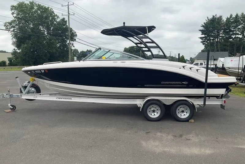Slide: The Image of 2023 Chaparral 23 SSi boat on trailer, parked outdoors, side view. - 10