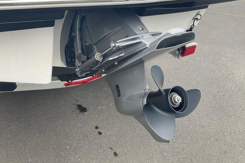 Slide: The Image of 2023 Chaparral 23 SSi boat propeller and outdrive on pavement. - 14