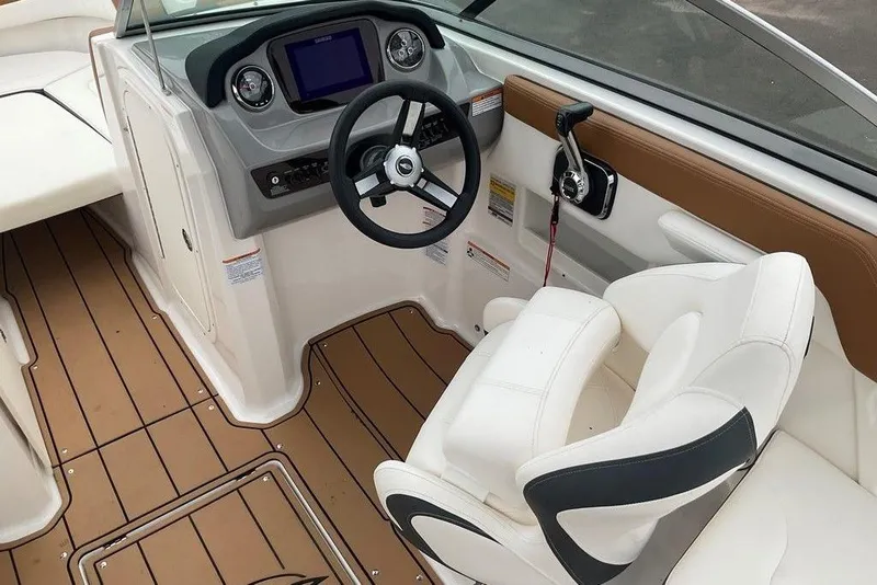 Slide: The Image of 2023 Chaparral 23 SSi boat interior with steering wheel and seating. - 18