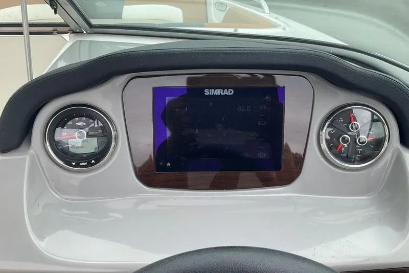 Slide: The Image of Dashboard of 2023 Chaparral 23 SSi boat with Simrad display and gauges. - 19