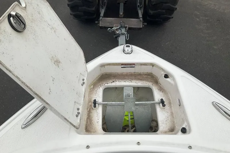 Slide: The Image of Open anchor compartment on 2023 Chaparral 23 SSi boat, showing anchor storage. - 31