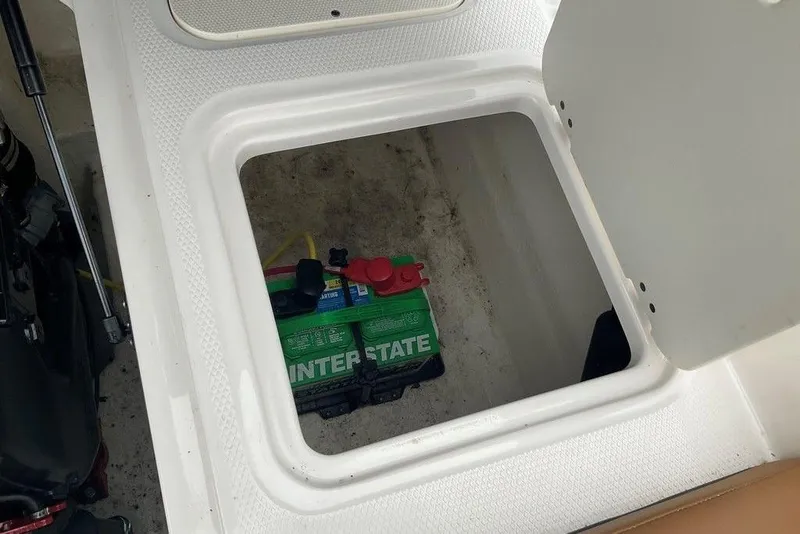 Slide: The Image of Battery compartment of 2023 Chaparral 23 SSi boat with Interstate battery visible. - 38