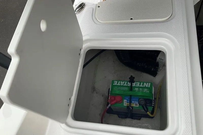 Slide: The Image of Battery compartment of 2023 Chaparral 23 SSi boat with Interstate battery. - 39