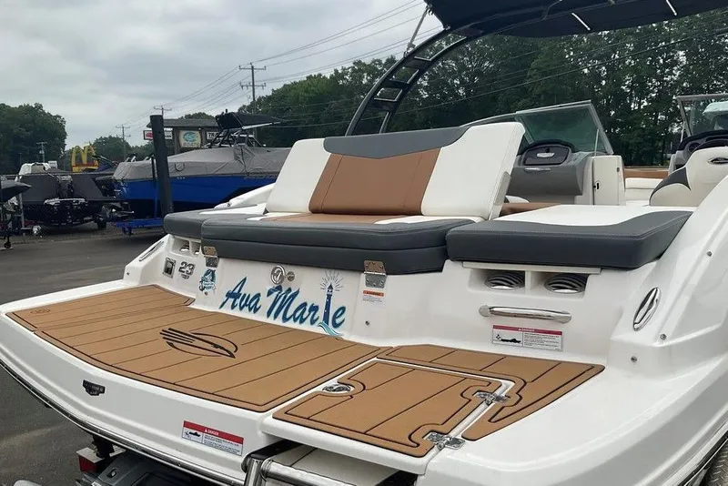 Slide: The Image of 2023 Chaparral 23 SSi boat with custom "Ava Marie" name on the deck. - 4