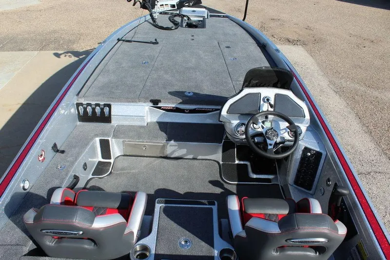 Slide: The Image of 2026 Phoenix 921 Elite X boat interior with steering wheel and seating. - 10